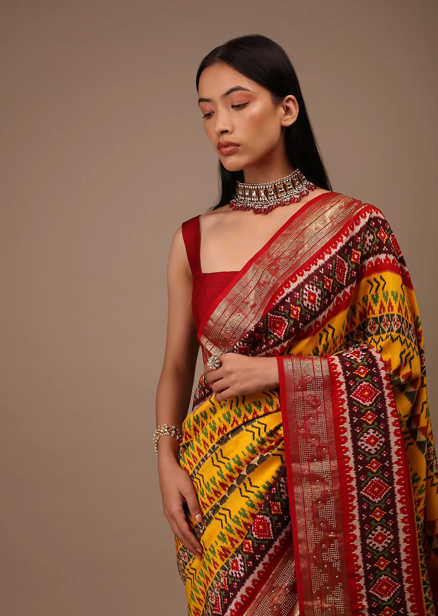 Chrome Yellow Saree In Silk With Multi Colored Patola And Foil Print And Contrasting Maroon Border
